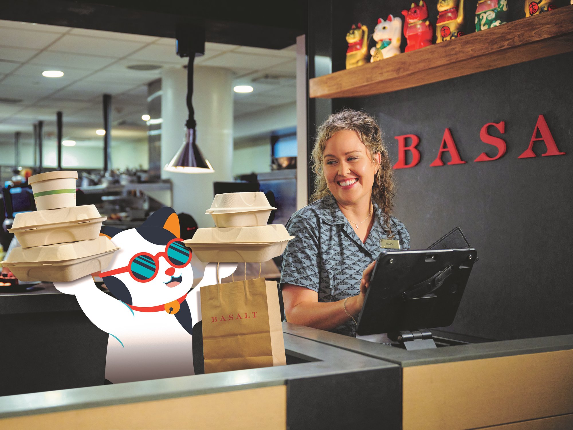CPB Shaka Cat helping hostess at the Basalt restaurant with a takeout order.